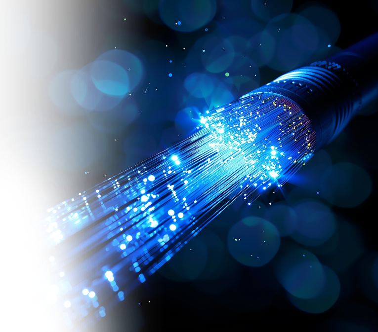 Illuminated fiber-optic cables showcasing high-speed data transmission, representing dark fiber and dedicated bandwidth